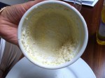 Place a scoop of breadcrumbs inside the ramekin and roll it around to coat and tip out excess